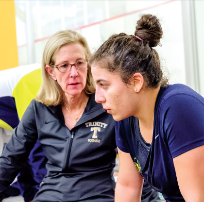 According to head coach Wendy Bartlett (l), no other player in her thirty-two years at Trinity has accomplished what El Defrawy did on the Bantam squad.