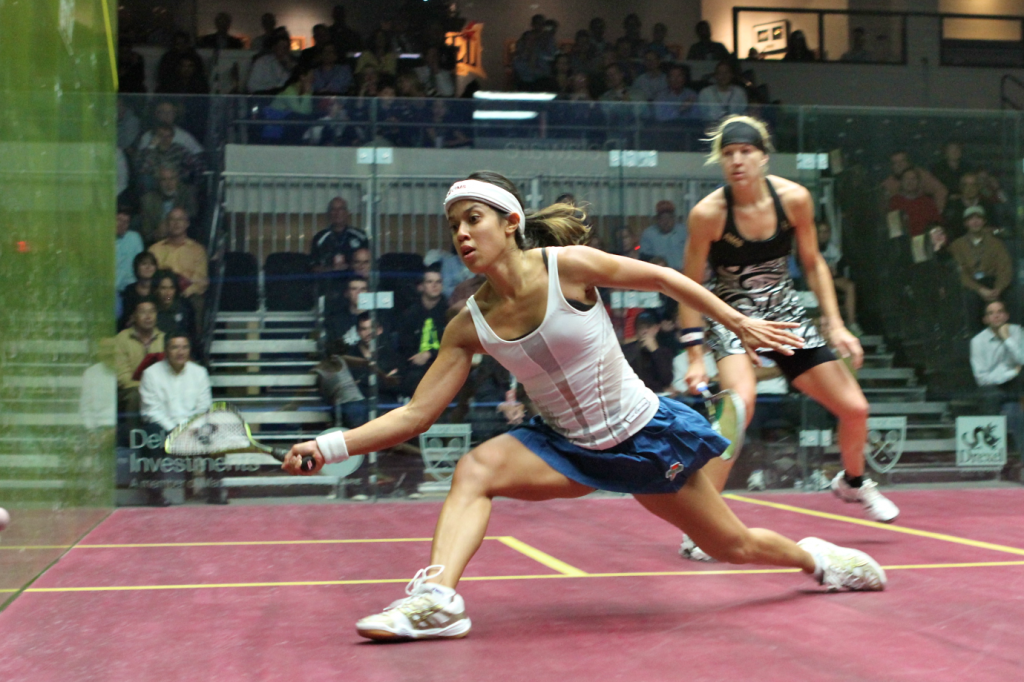 Watching players like Nicol David can be so much more than just pure entertainment if you do so with an eye toward what is actually happening on court. Here, note the open face of her racquet, her excellent balance in a deep lunge and the angle she took to the ball—and the position Kasey Brown has taken behind her.