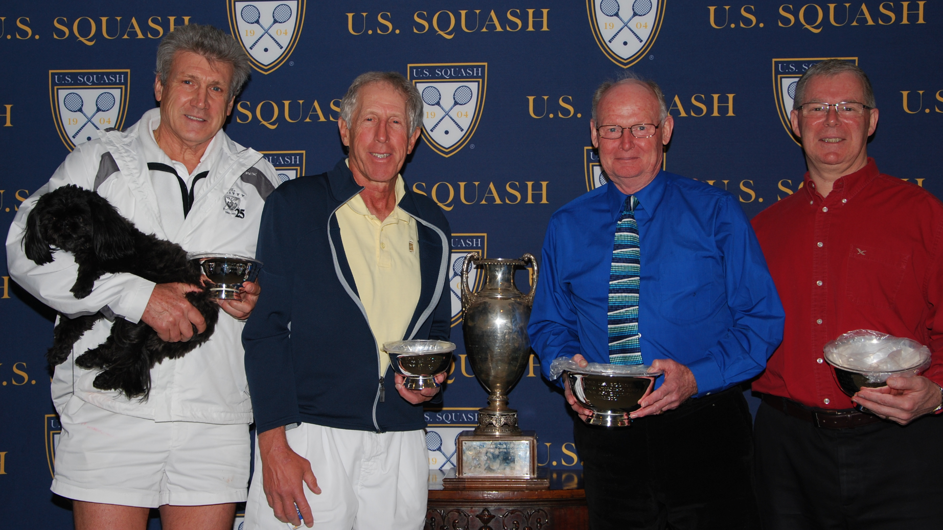Despite pulling a hamstring in the third game, Molson Robertson (R) was able to recover with help from his partner Tony Swift to win in the Men's 65+ title over Tom Poor (L) and Lenny Bernheimer.