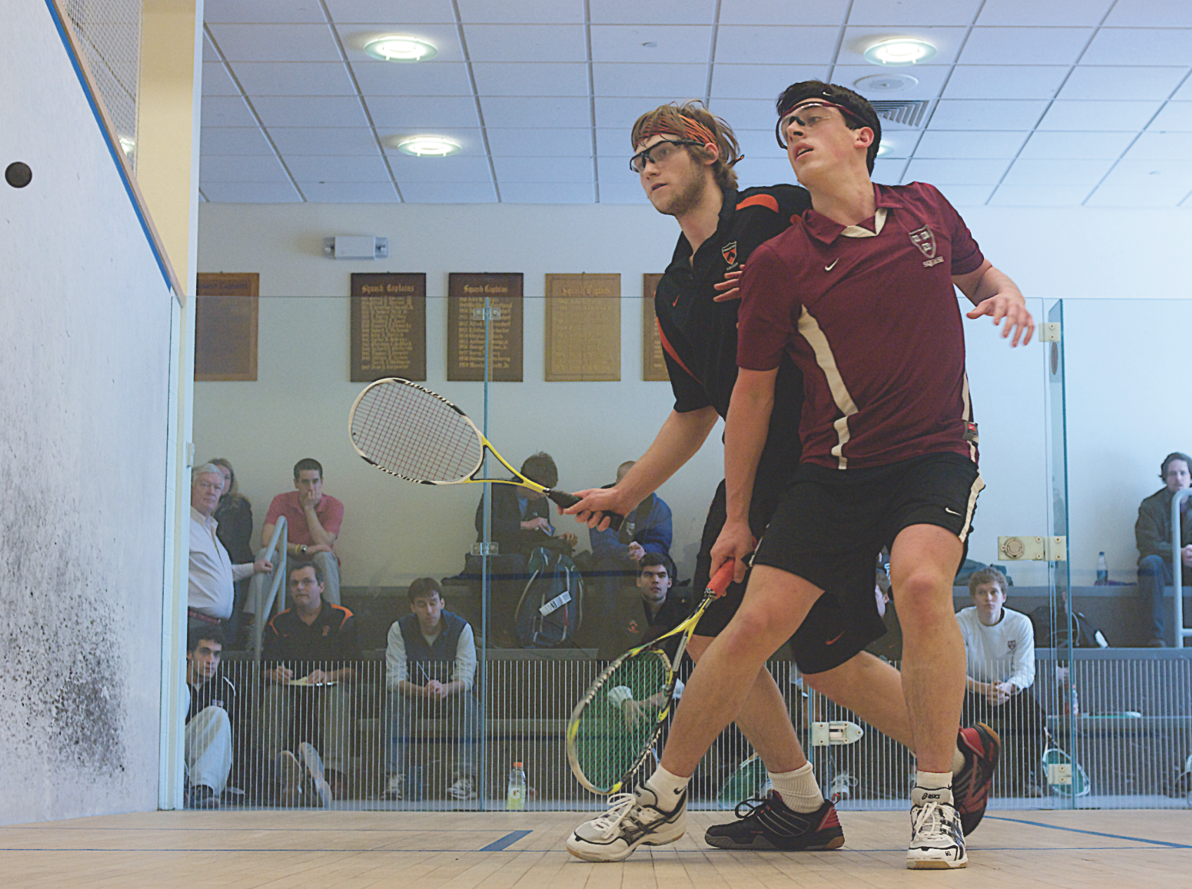 Princeton's Chris Callis (L) and Harvard's Zeke Scherl, will both be looking to lead their respective teams to the promised land—if they can put a halt to Trinity's 224-match unbeaten string.