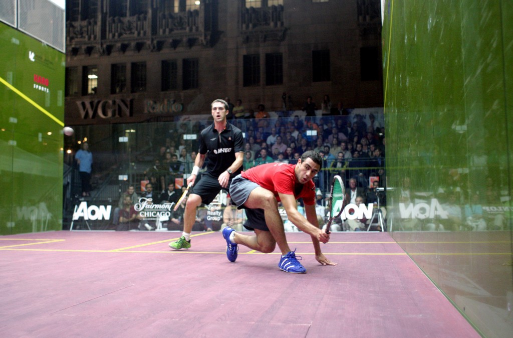 By night, the court lit up the Pioneer Court in front of the Tribune Tower as Ramy Ashour dashed to a three-game win in the semis over David Palmer. 