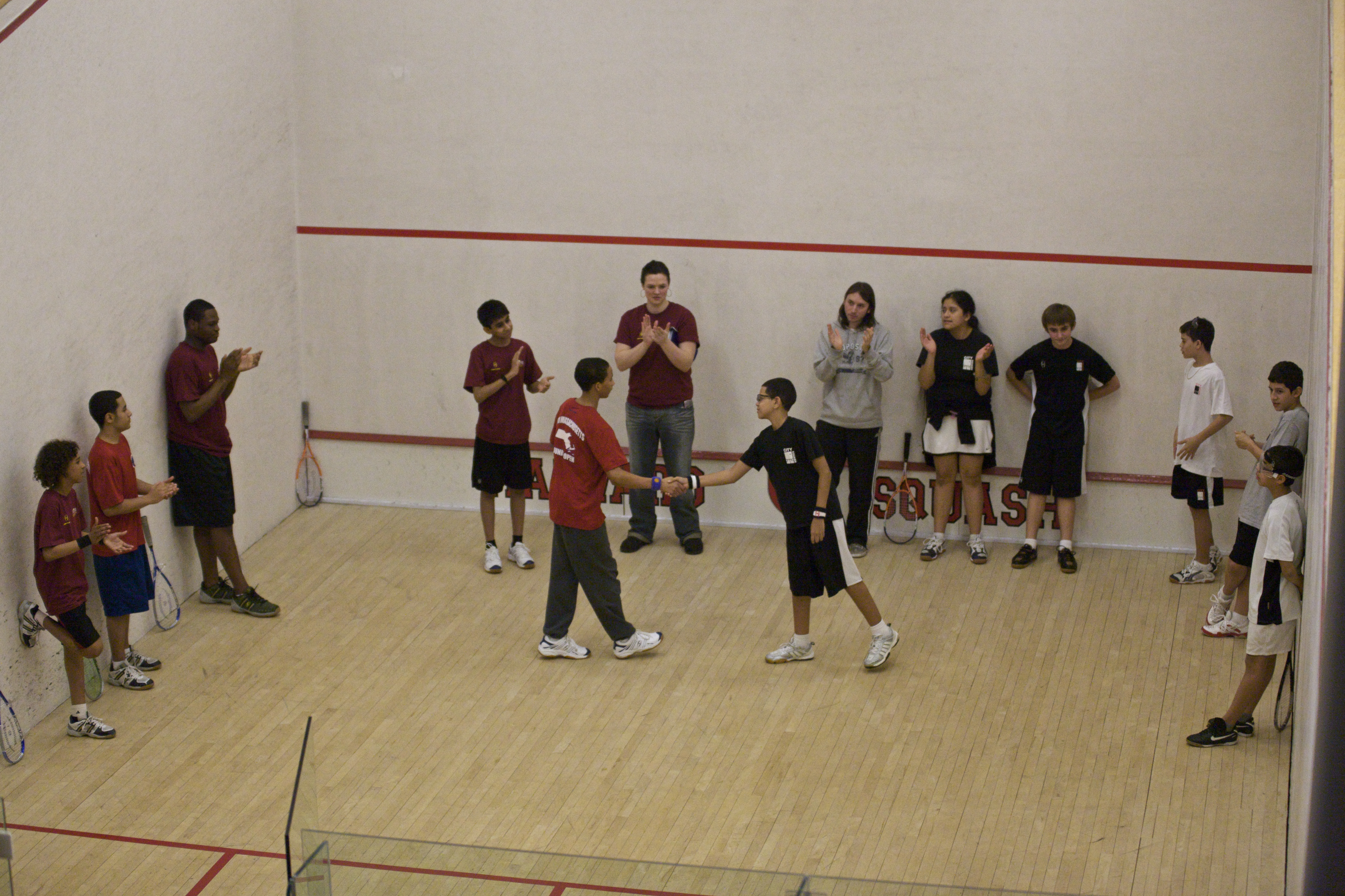 Pre-match introductions between the SquashBusters BU15 A team (L) and the CitySquash BU19/17 B Team, won by CitySquash who went on to win the consolation division.