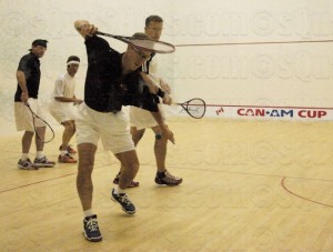 American Chris Spahr winds up to hammer a forehand with teammate Doug Lifford clearing room for the shot.