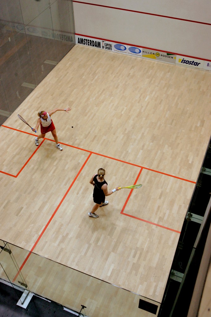 In the photo above, the returner has taken a more aggressive position by moving forward in the serve court, whereas below, you see Tania Bailey in more of a centered position as Vanessa Atkinson serves.