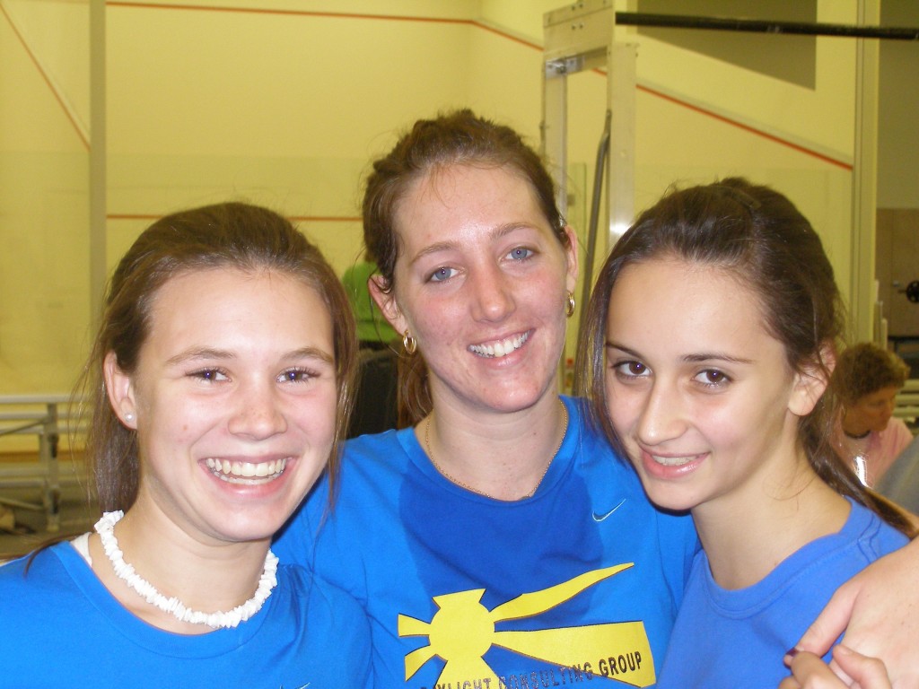 National Capitol’s No. 1 player, Larissa Stephenson, celebrates her team’s Howe Cup championship with protegees Ann Bellinger and Camille Lanier, who became friends playing squash.