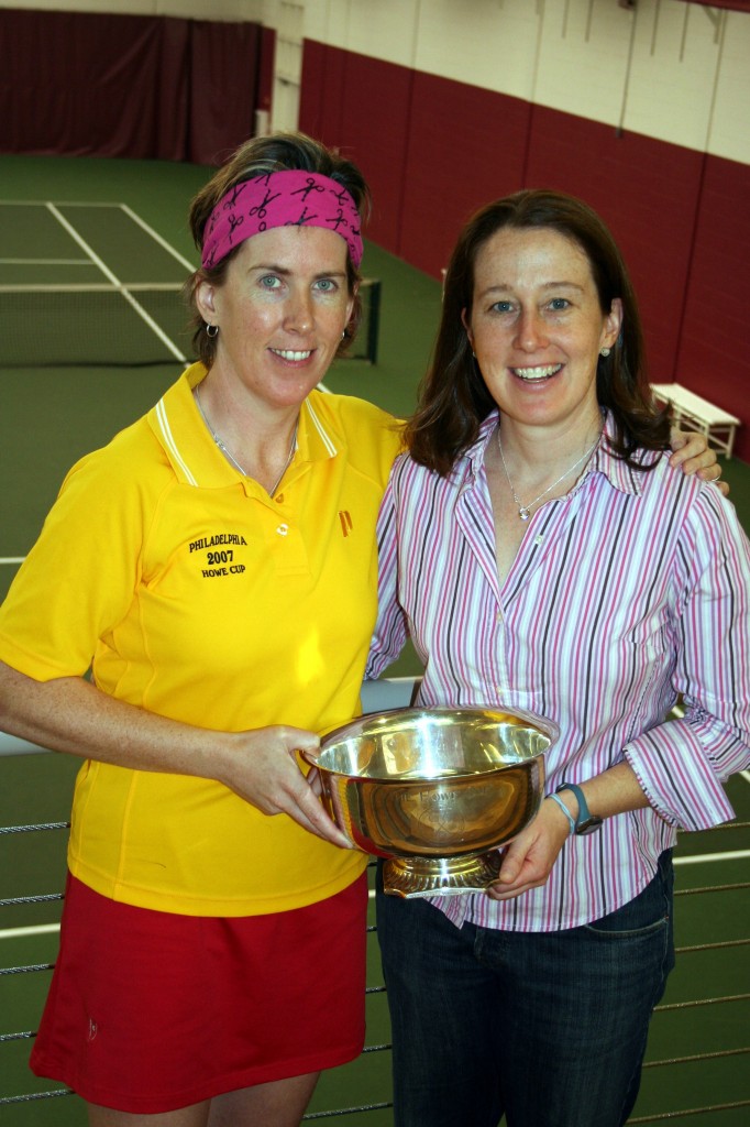 2007 chair, Meredith Johnson, who led the stellar organizing effort while maintaining her orthopedic surgery practice, passes the Howe Cup to Orla Doherty (wearing yellow), who will oversee the 2008 championship in Philadelphia.