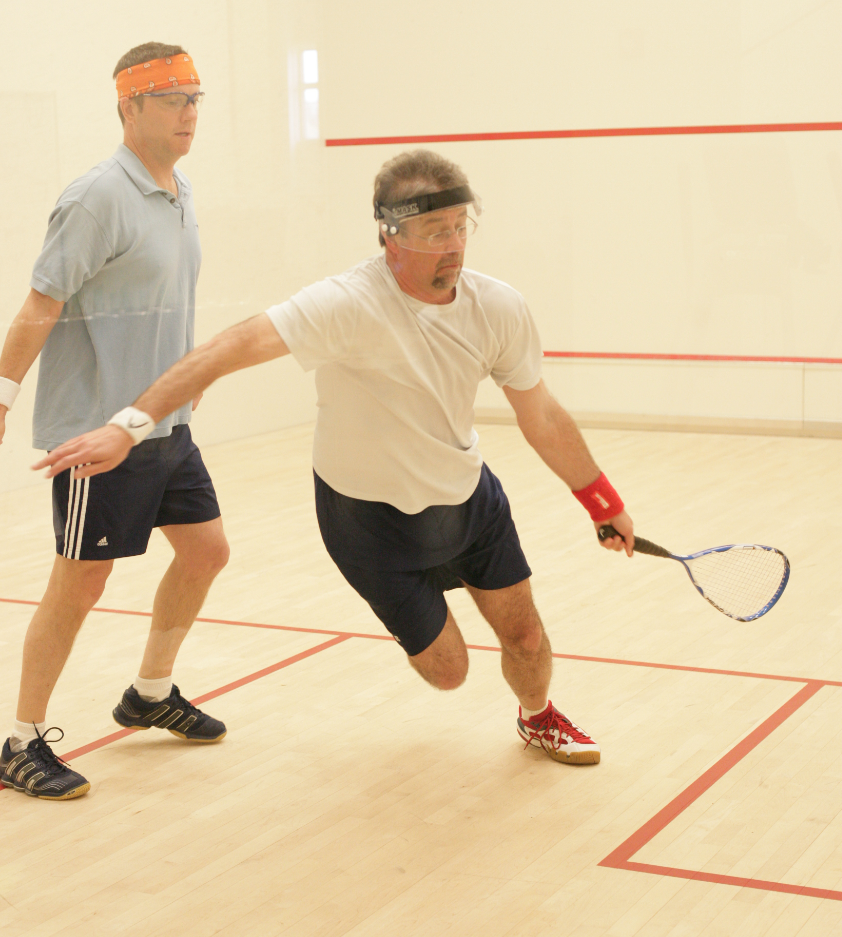 Jonathan Atwood (orange headband), seeded No. 1 in the M3.5, won the division without dropping a game including a 3-0 win over second seeded Karl Francis. 