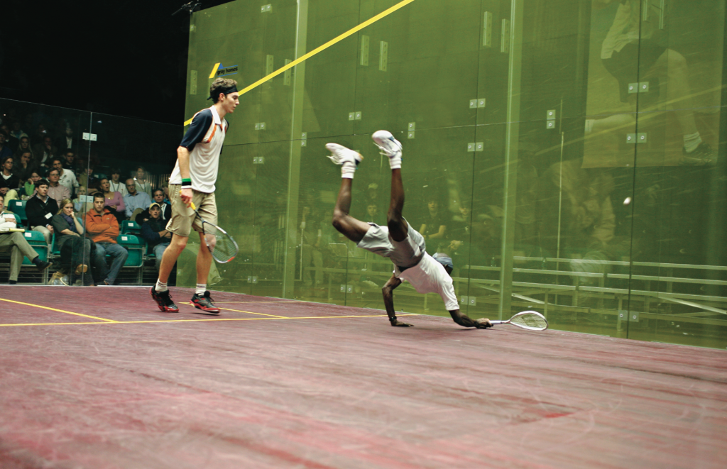 Though Australian Cameron Pilley (L) won his opening round match easily over local favorite Patrick Chifunda (originally from Zambia), Chifunda put on an impressive display of athletic prowess by diving for balls all over the court.
