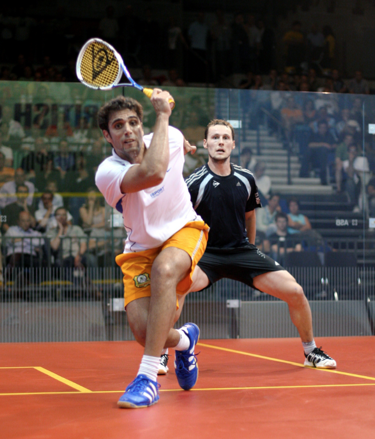 After finishing off the defending champion, Gregory Gaultier (in black at left), Karim Darwish moved on to face David Palmer in the semifinals but was forced to retire after injuring his Achilles.