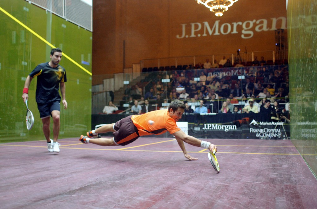Iskandar (diving) showed his mettle—and a little blood—in a marathon first round match with Hungary’s Mark Krajcsak. After winning the first game in a tiebreaker, losing the second 11-1, winning the third but dropping the fourth in another tiebreaker, Iskandar laid it all on the line and outlasted Krajcsak 11-4 in the fifth.