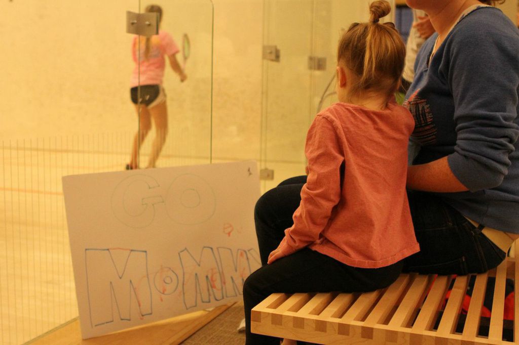 DC's Elena Guaranello was cheered on by her two-and-a-half year old daughter (above) and wife was supported by a "Go Mommy" sign throughout the weekend.