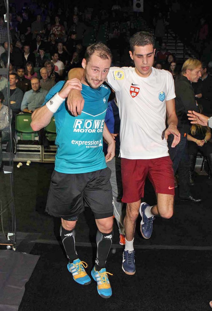 Gaultier helped Ali Farag off the court after Farag had leg cramps following their five-game match. 