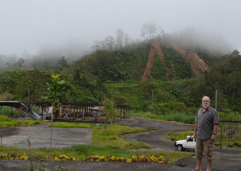 In September, Gould's Panguna neighbor and principal at the primary school, Peter Cromford (r), blogged about his emotional return to Panguna twenty-five years after evacuating. What is left of the school and the indoor cricket court can be seen in the background. 